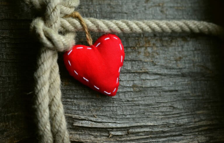 Red heart tied to rope - showing connection